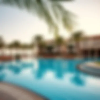 Relaxing Atmosphere at the Resort's Swimming Pool Luxurious swimming pool surrounded by palm trees