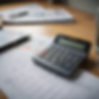 A calculator and financial documents on a desk